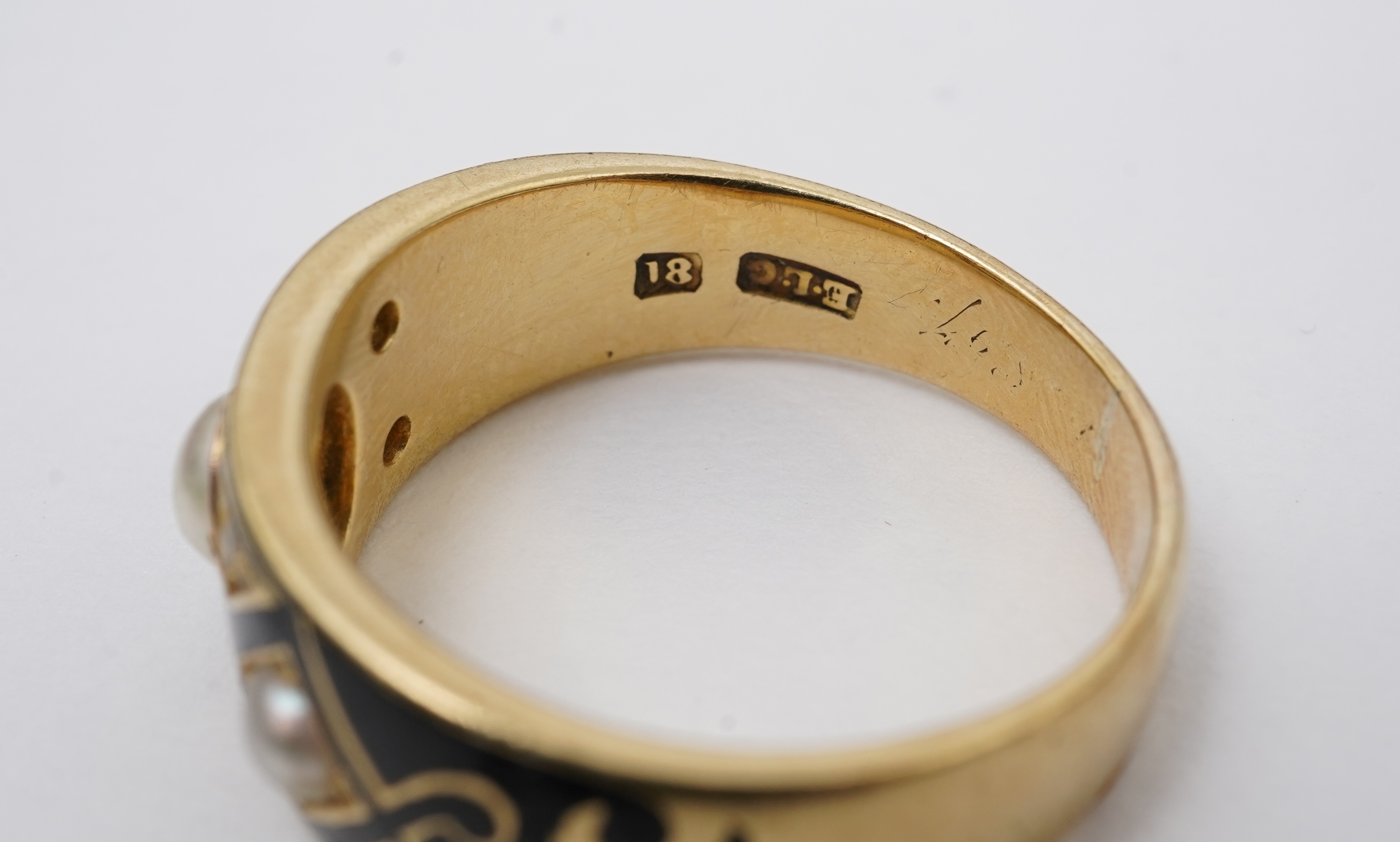 A Victorian pearl, enamel and diamond mourning ring, late 19th century